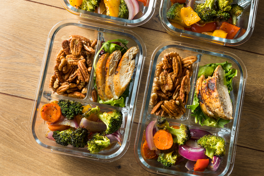 Homemade Keto Chicken Meal Prep with Veggies in a Container. portions. over eating