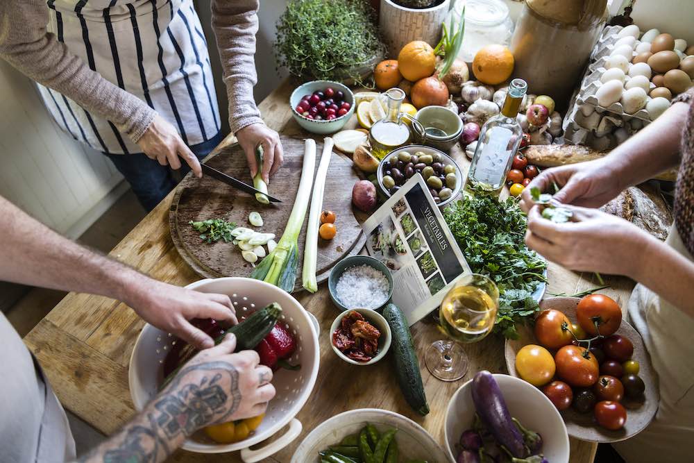 People cooking healthy food in the kitchen