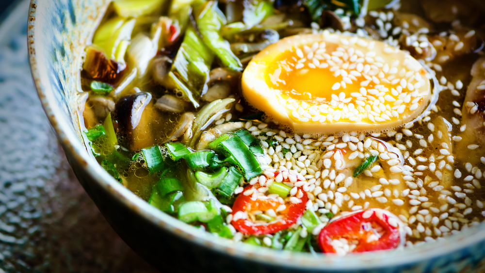 Ramen Soup in Bowl. Rich flavour chicken broth with Miso paste, grilled teriyaki chicken, leeks, mushrooms, pickled eggs, egg noodles, onion, chili pepper, lemongrass. Thai, Asian, Chinese. heart healthy. red meat free meals