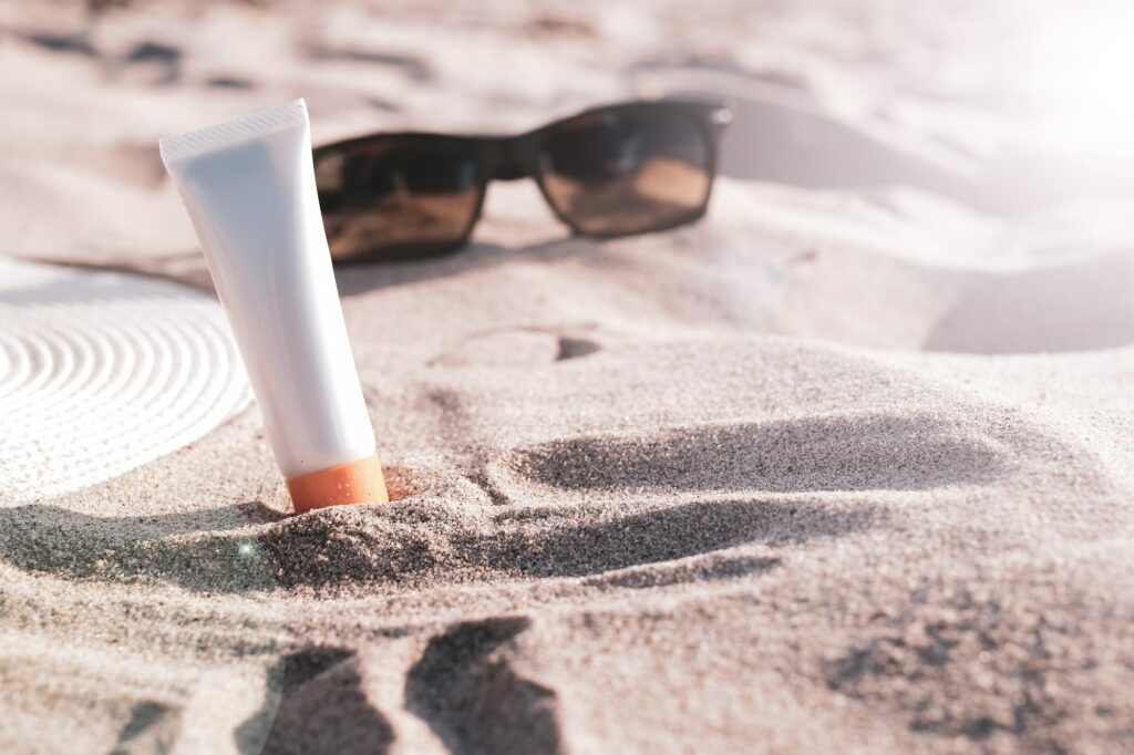 sun protection beauty sunscreen on the beach.
