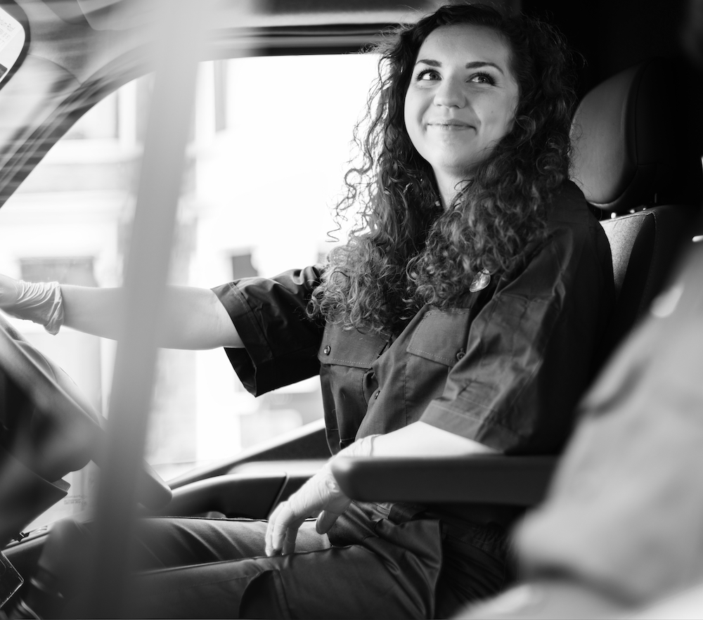 Paramedic woman driving an ambulance